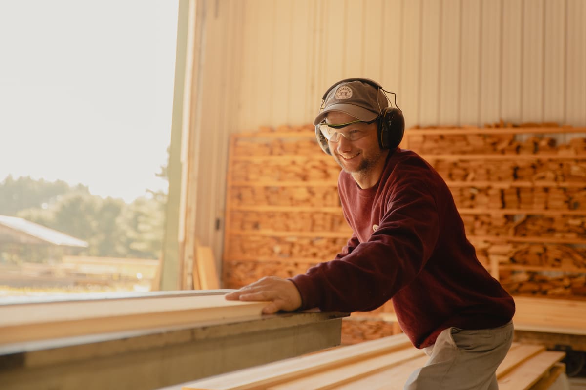 Haselton Lumber team member operating mill shop equipment