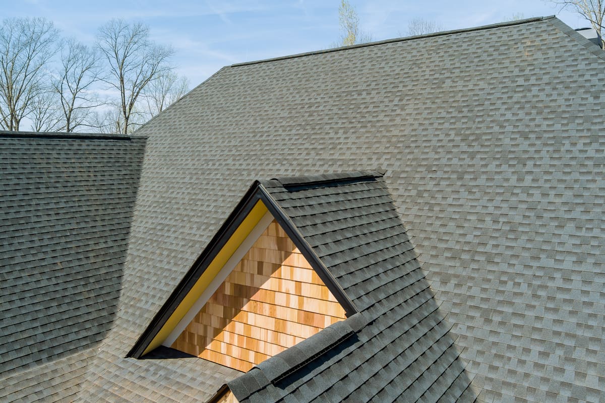 House roof with shingles and wood shakes